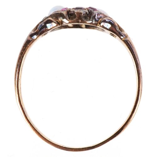 3165 - An antique unmarked gold graduated opal and ruby cluster ring with pierced shoulders, size N, 2.1g.