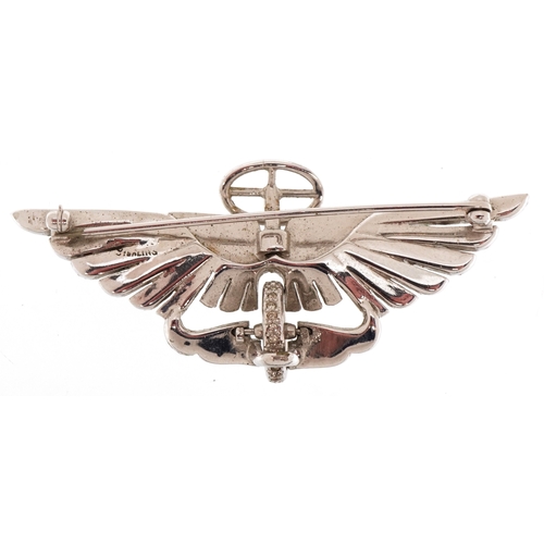 3366 - A sterling silver and clear stone brooch in the form of an Austin radiator badge, 7cm wide, 18.8g.