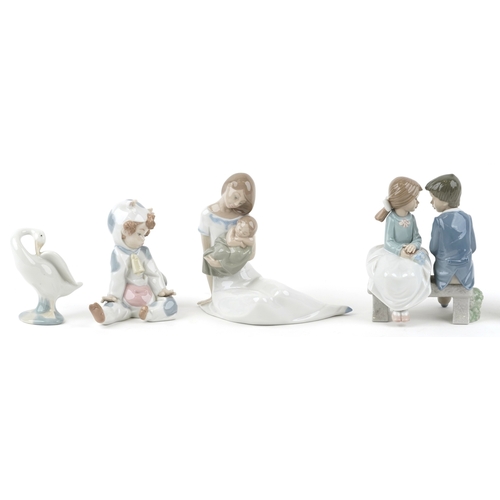 628 - Eight Lladro and Nao porcelain figures and animals including a child in a cow costume, a young boy a... 