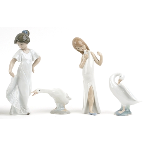 628 - Eight Lladro and Nao porcelain figures and animals including a child in a cow costume, a young boy a... 