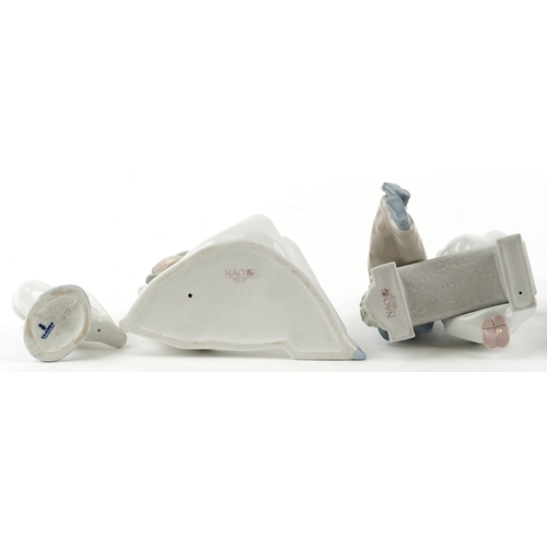 628 - Eight Lladro and Nao porcelain figures and animals including a child in a cow costume, a young boy a... 