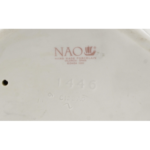 628 - Eight Lladro and Nao porcelain figures and animals including a child in a cow costume, a young boy a... 