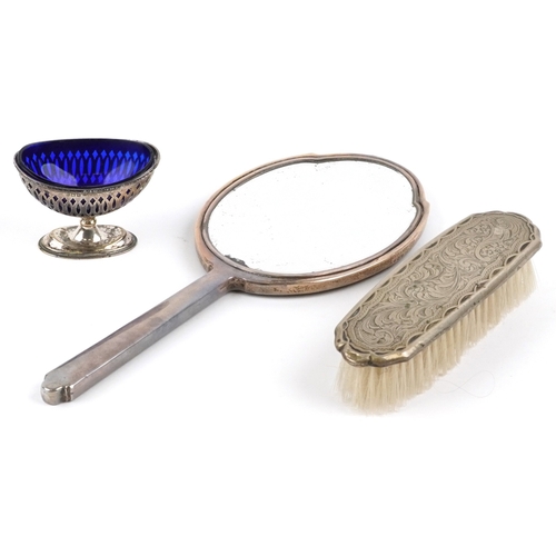 3670 - Edwardian and later silver objects comprising and engine turned hand mirror, an open table salt with... 