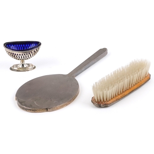 3670 - Edwardian and later silver objects comprising and engine turned hand mirror, an open table salt with... 