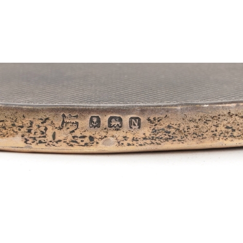 3670 - Edwardian and later silver objects comprising and engine turned hand mirror, an open table salt with... 