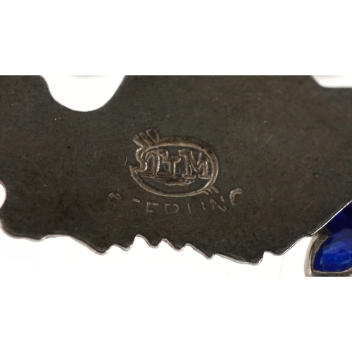 3442 - A silver charm bracelet with mostly silver charms including a seahorse, clown and a filigree jug, 57... 