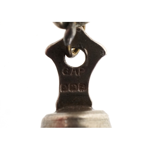 3442 - A silver charm bracelet with mostly silver charms including a seahorse, clown and a filigree jug, 57... 