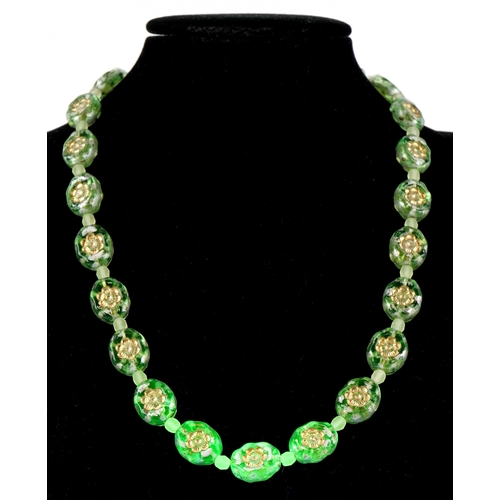 3370 - A uranium glass bead necklace with floral design, 40cm in length, 30.2g.