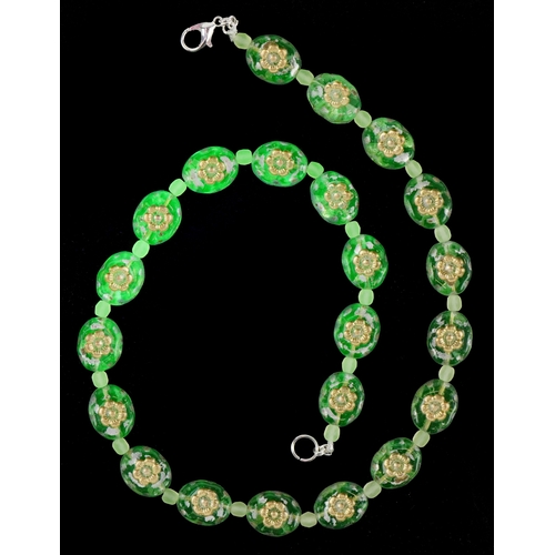 3370 - A uranium glass bead necklace with floral design, 40cm in length, 30.2g.