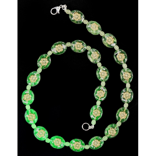 3370 - A uranium glass bead necklace with floral design, 40cm in length, 30.2g.
