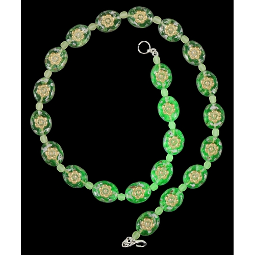 3370 - A uranium glass bead necklace with floral design, 40cm in length, 30.2g.