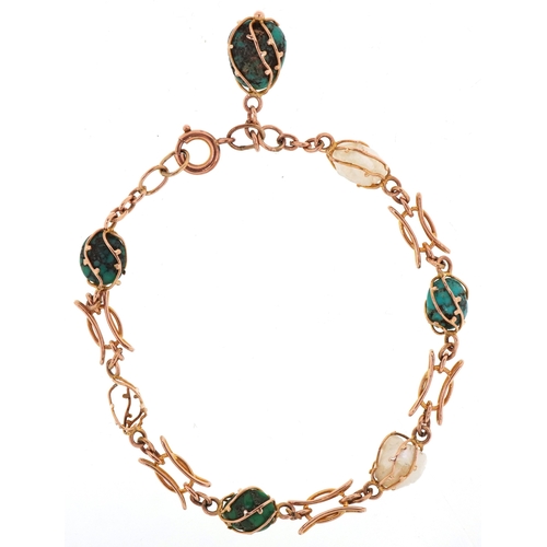 3109 - An unmarked gold turquoise and freshwater pearl bracelet, 19cm in length, 8.4g.