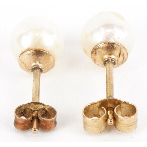 3205 - A pair of 9ct gold cultured pearl stud earrings, 6.5mm in diameter, total 1.2g.