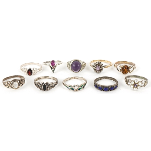 Ten silver rings, some unmarked, including ruby, natural amber and ...
