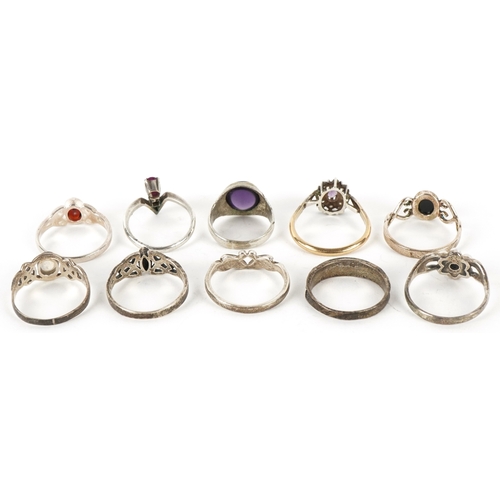 Ten silver rings, some unmarked, including ruby, natural amber and ...