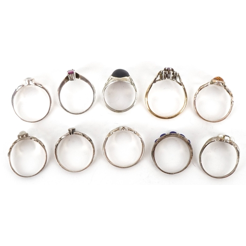 Ten silver rings, some unmarked, including ruby, natural amber and ...