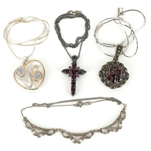 3359 - Four silver necklaces including an amethyst cross pendant and a garnet and marcasite cluster pendant... 