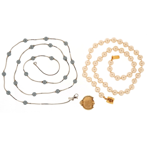3524 - Vintage Monet designer jewellery comprising two simulated pearl necklaces and a ladybird brooch, the... 