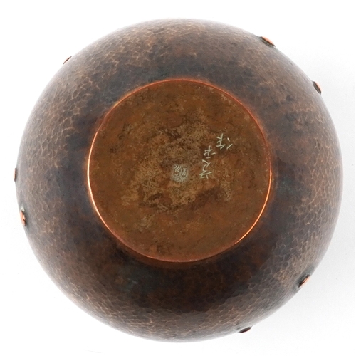 460 - A Japanese copper vase with planished decoration character marks to the base, 18cm high.