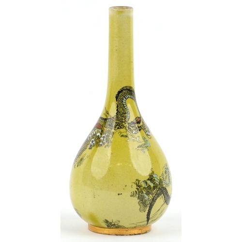 323 - A Doulton Lambeth Aesthetic movement bottleneck vase decorated with dragons amongst enamelled waves ... 