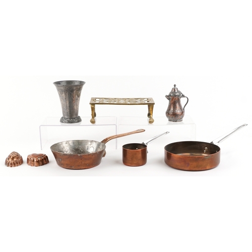 1786 - Antique metalware including a brass trivet, copper warming pans and jelly moulds, the largest 40cm i... 