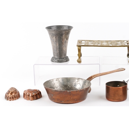 1786 - Antique metalware including a brass trivet, copper warming pans and jelly moulds, the largest 40cm i... 