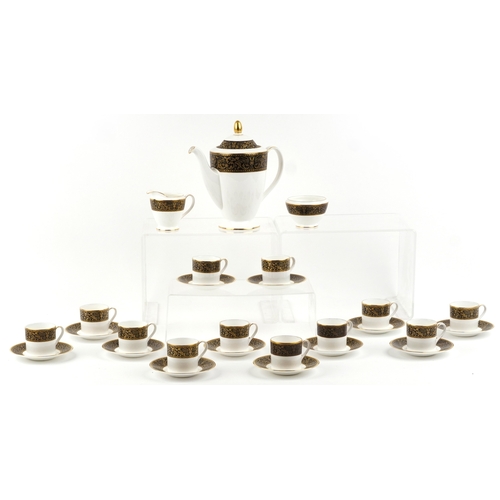 658 - A Minton Grandee pattern twelve place coffee service, the coffee pot 23cm high.