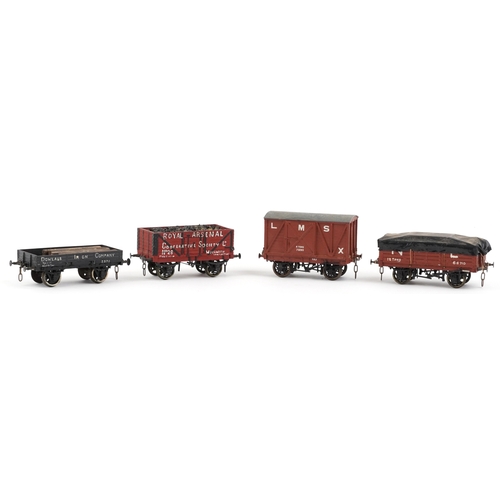 733 - Four vintage scratch built O gauge model railway wagons, the largest 12cm in length.