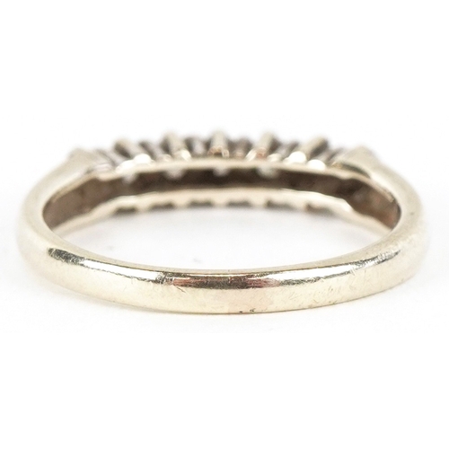 3053 - A 9ct gold diamond half eternity ring, total diamond weight approximately 0.25 carat, size G, 1.7g.