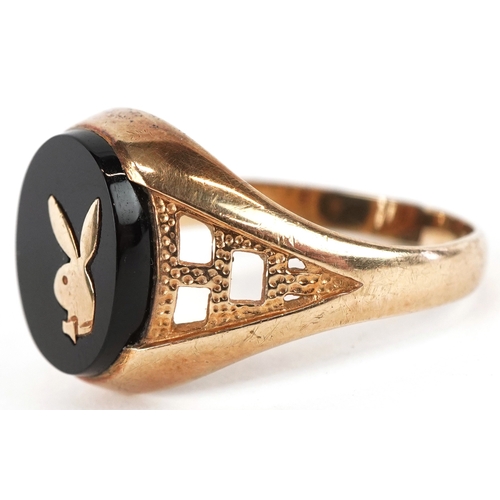 3034 - A 9ct gold onyx Playboy Bunny signet ring, size R/S, 3.2g.