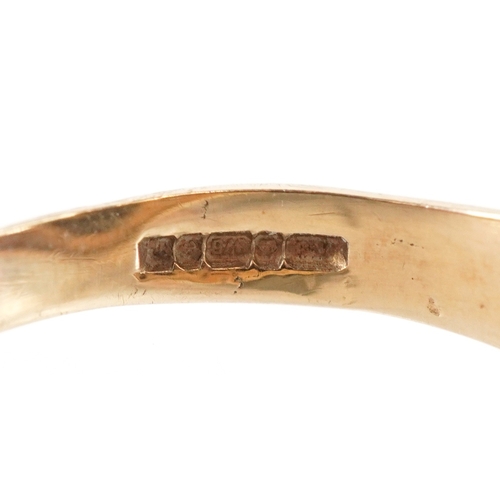 3034 - A 9ct gold onyx Playboy Bunny signet ring, size R/S, 3.2g.