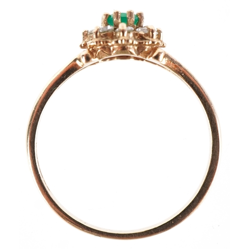 3170 - A 9ct gold green stone and clear stone flower head ring with split shoulders, size M, 1.6g.