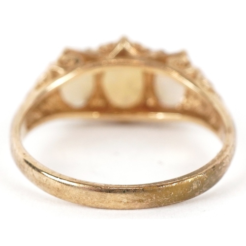 3120 - A 9ct gold graduated opal trilogy ring, size L/M, 2.4g.