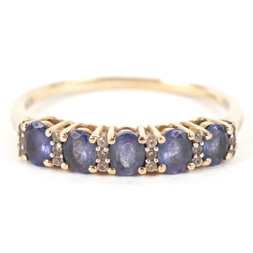 3232 - A 9K gold blue stone and clear stone half eternity ring, size T, 2.1g.
