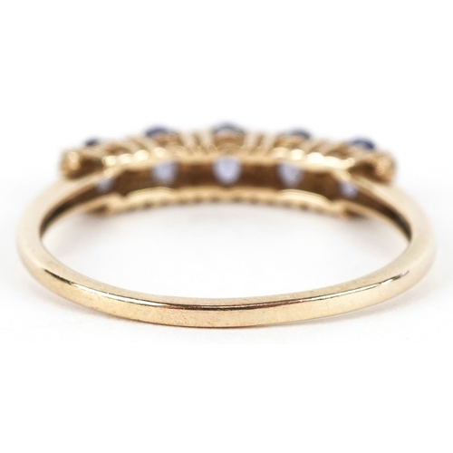 3232 - A 9K gold blue stone and clear stone half eternity ring, size T, 2.1g.