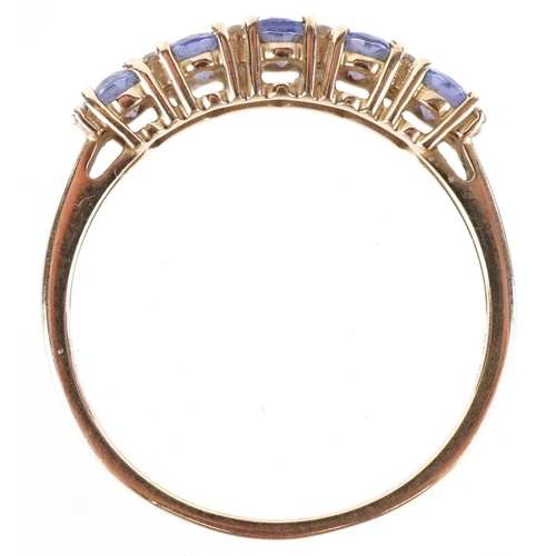 3232 - A 9K gold blue stone and clear stone half eternity ring, size T, 2.1g.