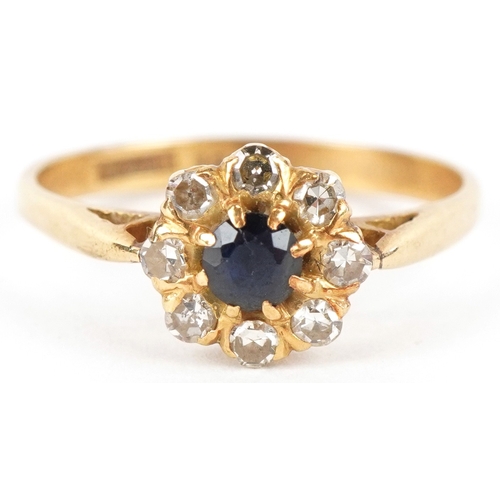 3097 - An 18ct gold diamond and blue spinel flower head ring, size L, 2.3g.