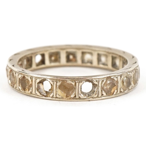 3295 - An unmarked white gold clear stone eternity ring, size N, 3.5g.