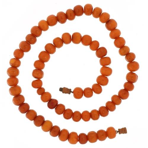 3441 - A butterscotch amber coloured bead necklace, each bead 8.5mm in diameter, 44cm in length, 21.5g.