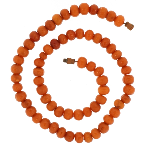 3441 - A butterscotch amber coloured bead necklace, each bead 8.5mm in diameter, 44cm in length, 21.5g.