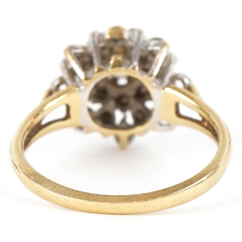 3198 - An 18ct gold diamond four tier cluster ring, the central diamond approximately 3.80mm in diameter, s... 