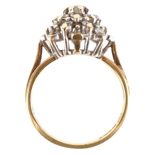 3198 - An 18ct gold diamond four tier cluster ring, the central diamond approximately 3.80mm in diameter, s... 