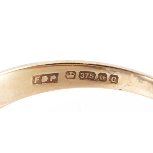 3223 - A 9ct gold blue spinel and diamond cluster ring, size R, 3.0g.