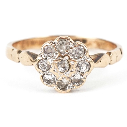 3084 - A 9ct gold clear stone flower head ring, size L, 1.8g.