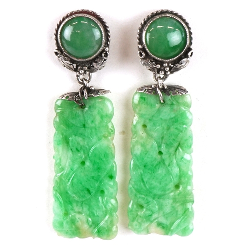 3058 - A pair of Chinese unmarked silver and green stone naturalistic carved drop earrings, tests as jade, ... 