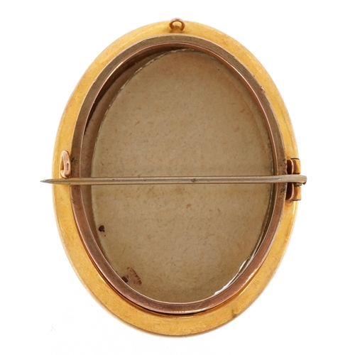 A 9ct gold double sided locket brooch, 4.5cm high, total weight 10.5g.