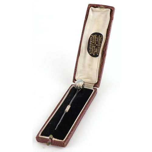 1468 - A small group of objects of Vertu including a moonstone mounted hatpin, two thimbles and a needle ca... 