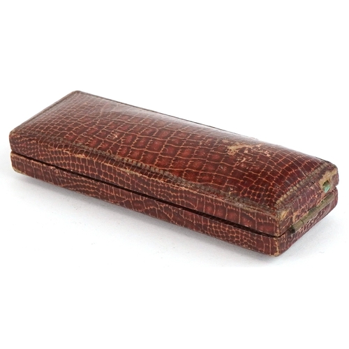 1468 - A small group of objects of Vertu including a moonstone mounted hatpin, two thimbles and a needle ca... 