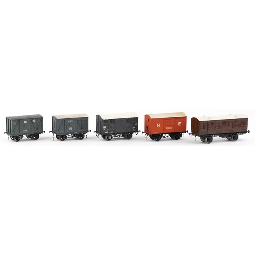 775 - Five vintage O gauge model railway wagons, the largest 18cm in length.