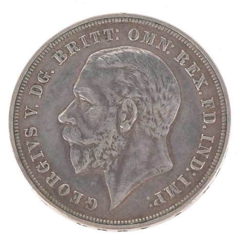 1077 - A 1935 George V Rocking Horse crown with script to the edge.